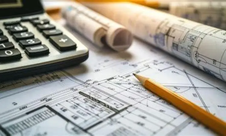 Estimator sedang menghitung volume material pada blueprint